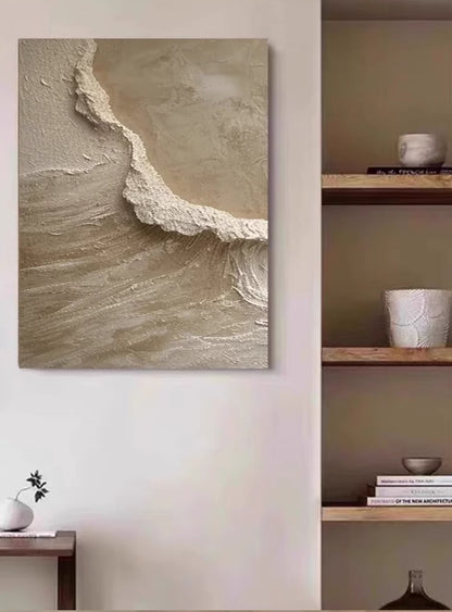 Textured abstract painting in beige tones featuring rough, layered surfaces and flowing patterns resembling a natural cliff or shoreline.