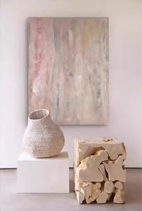 Abstract painting with soft pastel tones of pink, beige, and gray, featuring blurred, layered brushstrokes for a dreamy, ethereal effect.