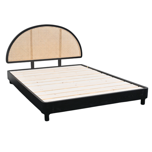 Black solid wood bed frame with a half-moon rattan headboard and wooden slat base.