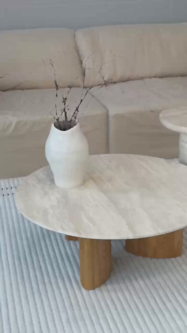 a coffee table with a natural travertine top and wooden base, beige colour